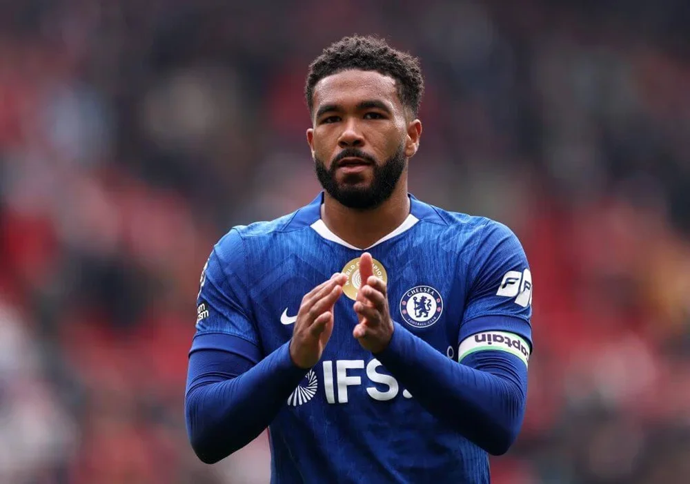 Reece James applauds during Chelsea's game against Liverpool
